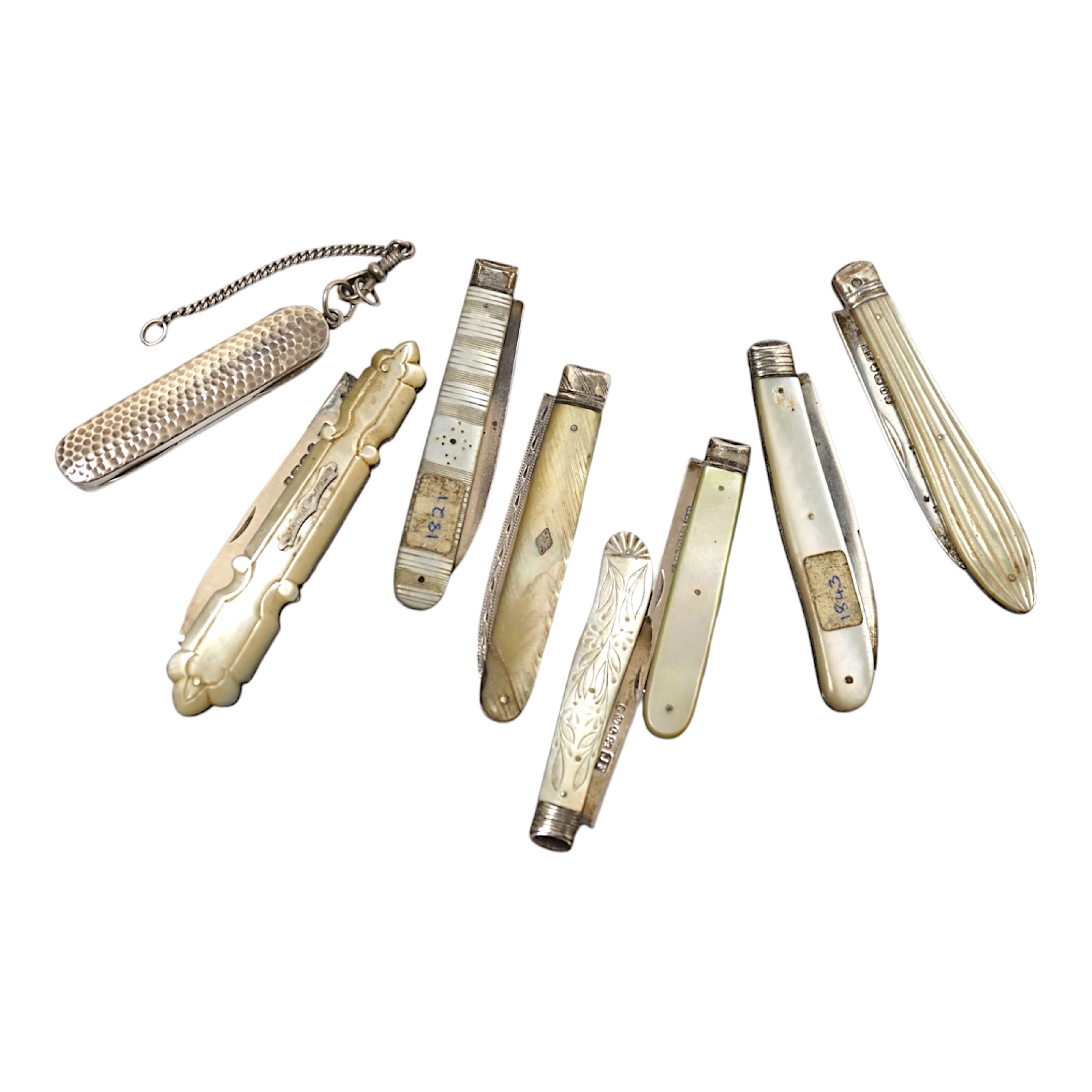 A collection of six assorted Victorian mother of pearl and silver bladed pocket fruit knives, a similar white metal fruit knife and a silver pin case. Condition - poor to fair